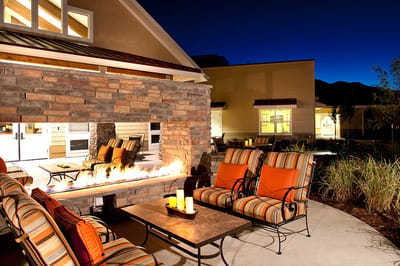 Outdoor patio area with cozy seating and fire feature