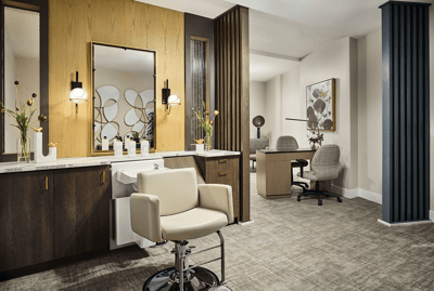 A modern salon area with elegant decor and seating
