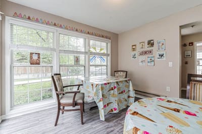 Bright room with ice cream-themed decor and tables