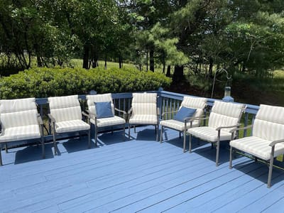 Empty outdoor seating area with striped chairs