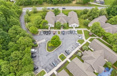 Aerial view of The Cottages of Perry Hall with parking area