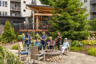 Residents enjoying music in an outdoor space