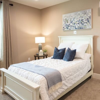 Cozy private bedroom with light decor and natural light
