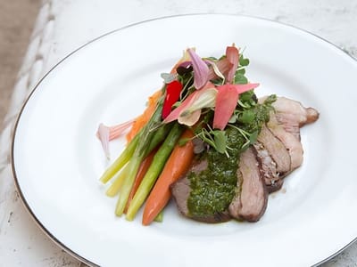 Gourmet meal presentation with colorful vegetables