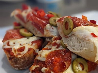 Close-up of pepperoni and olive breadsticks