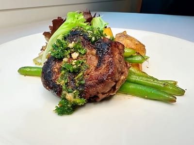 Plated meal featuring meat and vegetables