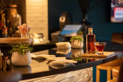 Interior bar area with drinks and plants