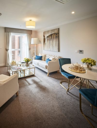 Living room area with a sofa and dining table