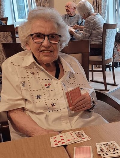 Resident playing cards in a common area