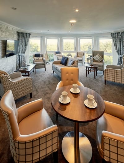 Cozy common area with seating and coffee