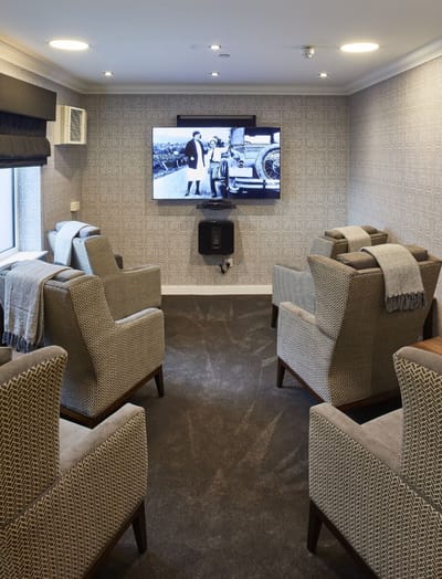 Cozy common area with comfortable seating and a TV