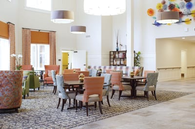 Bright interior common area with seating and decor