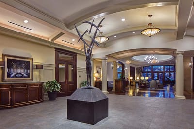 Interior view of a sophisticated lobby with sculpture