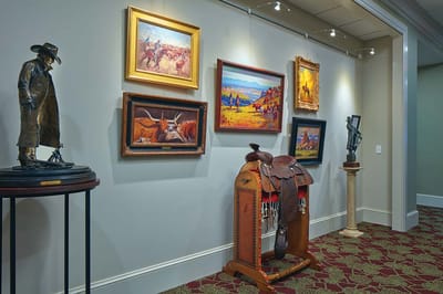 Decorative art and sculptures displayed in a hallway