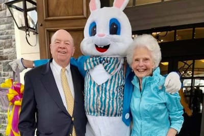 Seniors celebrating with a costumed bunny at an event