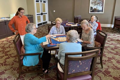 Residents engaging in a group activity in a communal space