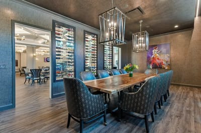 Dining room with a large wooden table and stylish chairs