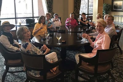 Residents enjoying drinks in a social gathering