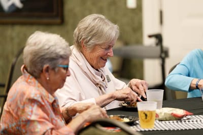 Two women enjoying a meal in the dining area
