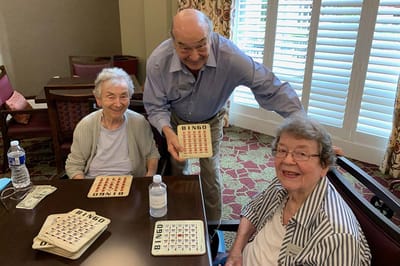 Residents playing bingo in a common area