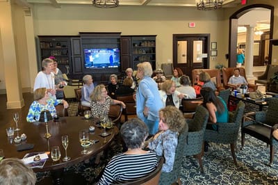 Residents engaged in conversation in a common area
