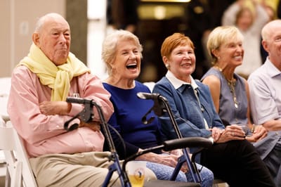 Residents enjoying an event with laughter and smiles