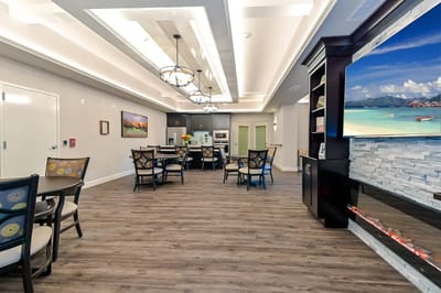 Bright common area with seating and kitchen