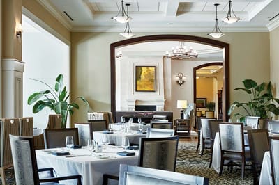 Elegant dining room setup in a senior living facility