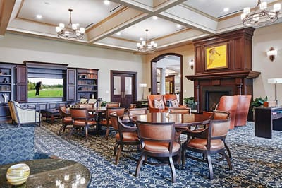 Bright common area with comfortable seating and a view