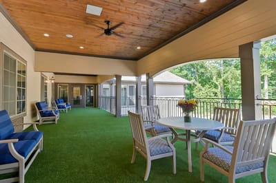 Outdoor seating area with a view of trees