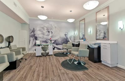 Interior view of a salon area with hair styling chairs