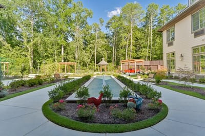 Beautiful landscaped outdoor area with a water feature