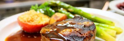 Plate of meatloaf with sides, indicating meal service