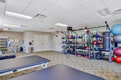 Well-equipped exercise room with various fitness equipment