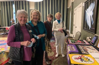 Residents participating in a craft activity indoors