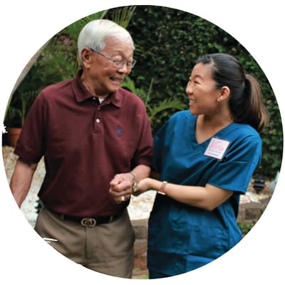 Staff member assisting a resident outdoors