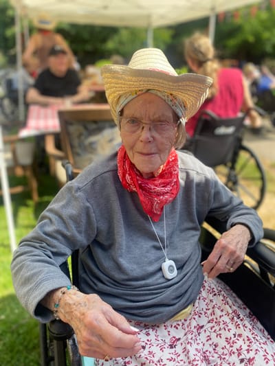 Resident enjoying an outdoor event in a cowboy hat