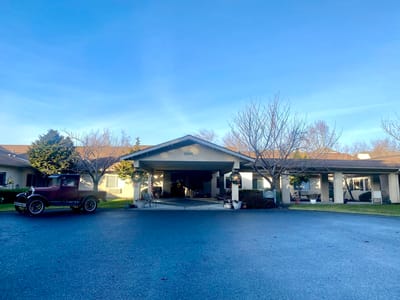Exterior view of Mt. Baker Care Center with vintage car