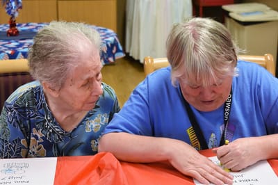 Two residents engaged in an arts and crafts activity