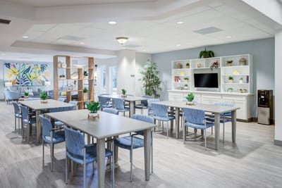 Interior common area with tables and chairs