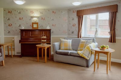 Cozy common area with piano and seating