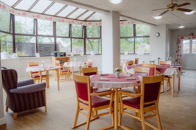 Bright dining area with tables and chairs