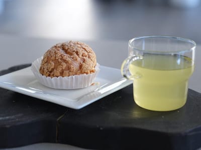 Food item and drink on a white plate and glass