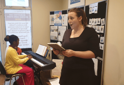 A staff member engaging with residents during an activity.