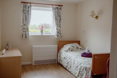 Private resident room with a bed and window