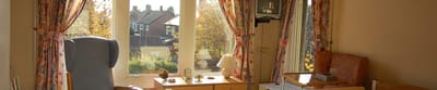 Comfortable resident room with natural light.