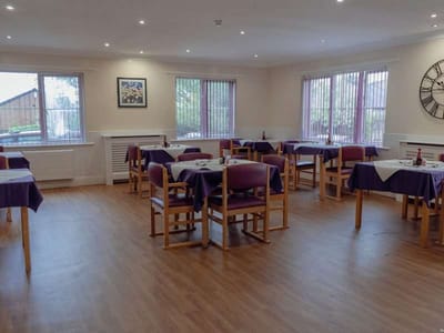 Dining area with tables and chairs set up