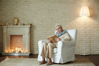 Senior reading in a cozy living space
