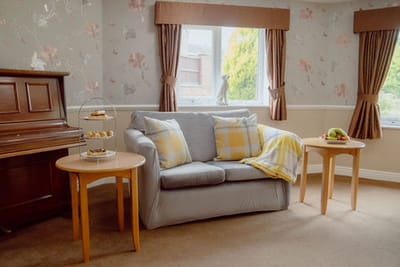 Cozy common area with a couch and piano