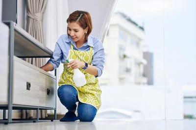 Staff member cleaning in a common area